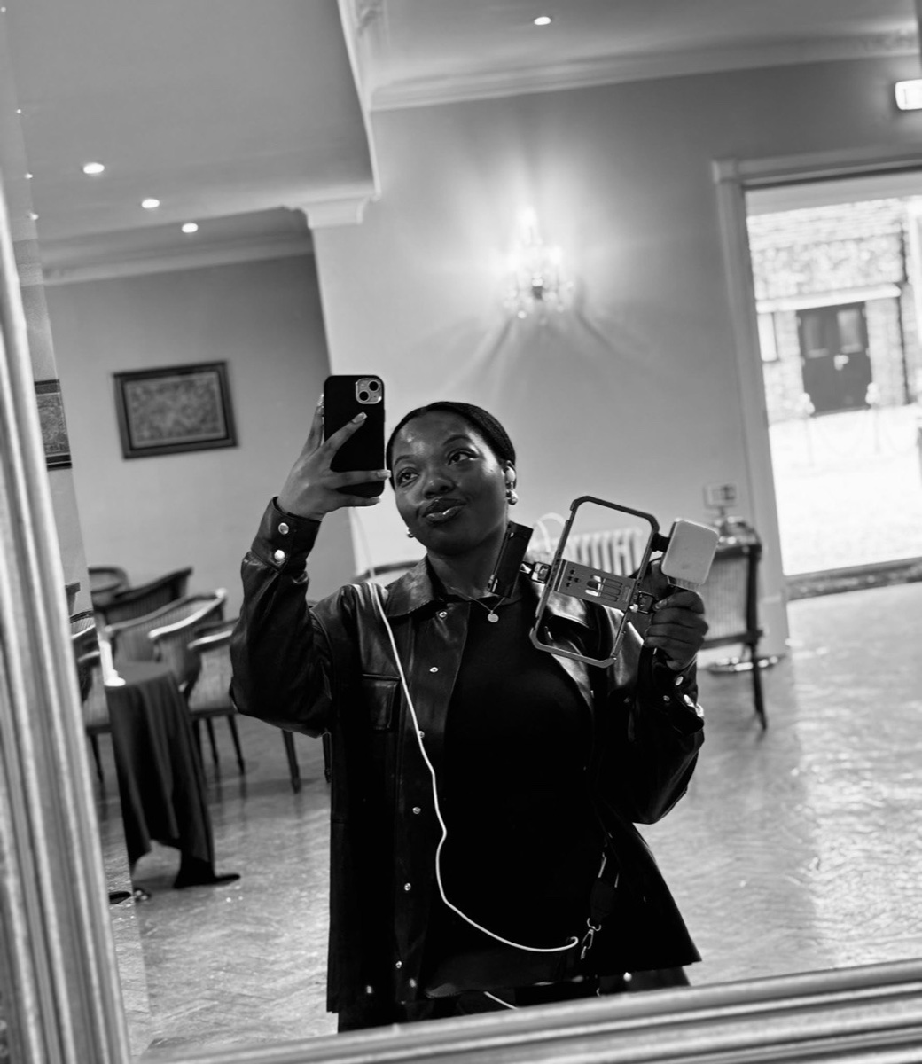 Simi, founder of SimplyCreates, filming at a venue
